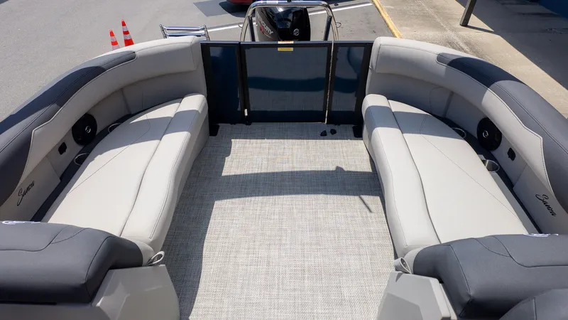 Slide: The Image of The image shows the interior of a Barletta SANZA 22QC boat with gray seating. - 8