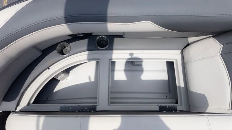 Slide: The Image of Close-up of a seating area with cup holders and storage compartment. - 6