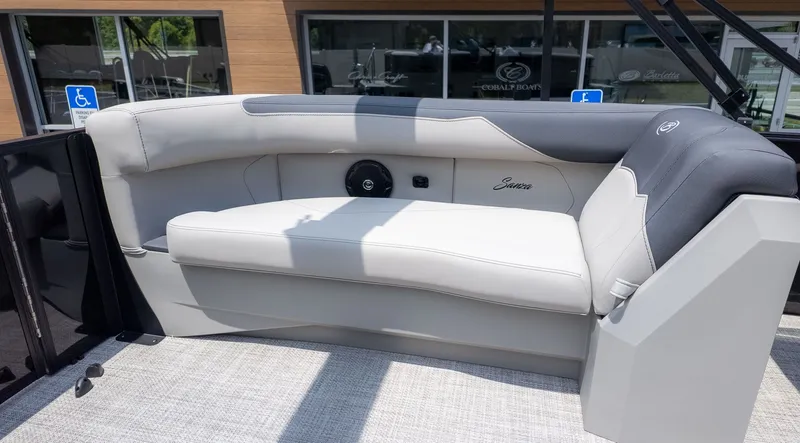 Slide: The Image of The image shows an elegant, upholstered bench seat on a boat. - 5