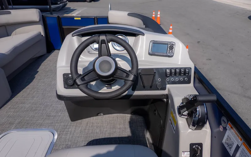 Slide: The Image of The image shows the helm of a 2026 Barletta Sanza S22QC boat. - 16