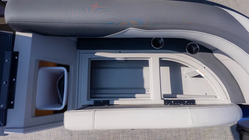 Slide: The Image of Interior view of a Barletta Sanza S22QC boat with gray upholstery and cup holders. - 14