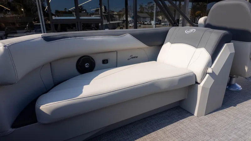 Slide: The Image of The image shows a luxurious lounge seat on a boat with gray and white upholstery. - 5