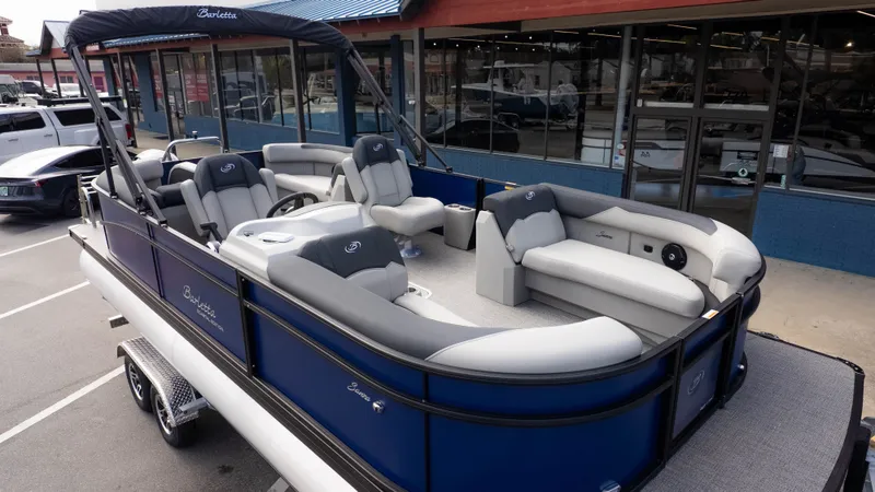 The Image of The image shows a 2026 Barletta Sanza S22QC pontoon boat with luxurious seating. - 1
