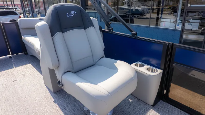 Slide: The Image of The 2026 Barletta Sanza S22QC features a luxurious seat with cup holders on a boat. - 6