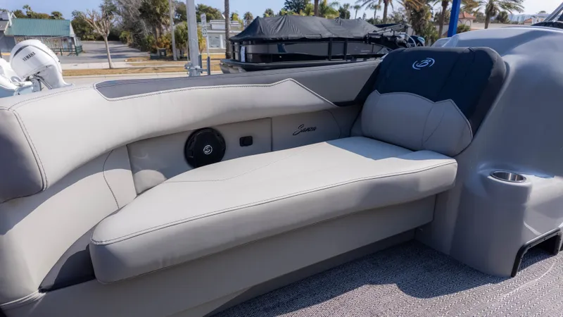 Slide: The Image of The image shows a luxurious seating area on a Barletta Sanza S22QC boat. - 13