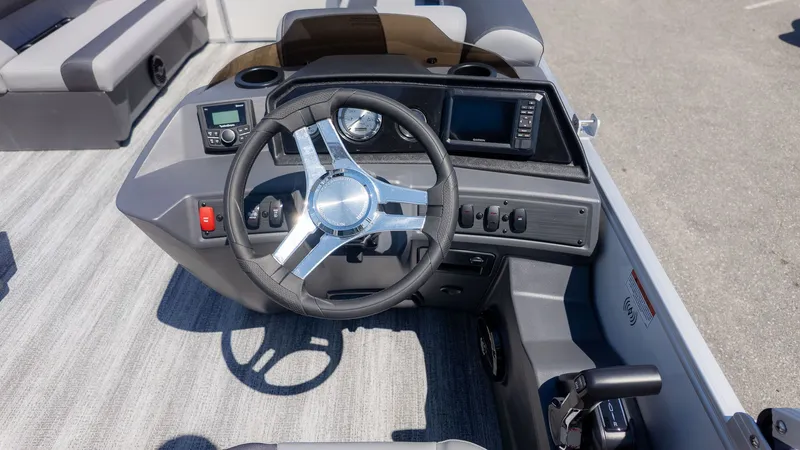Slide: The Image of The image shows the helm of a 2026 Bennington 20 S Cruise boat. - 17