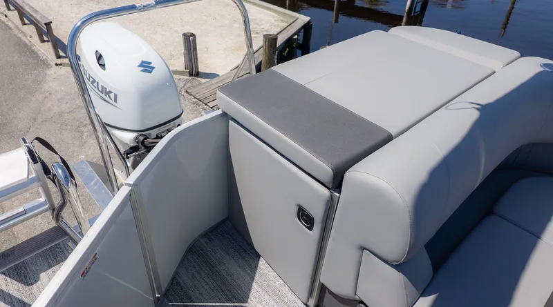 Slide: The Image of The image shows the stern of a Bennington 20 S Cruise boat with a Suzuki outboard motor. - 3
