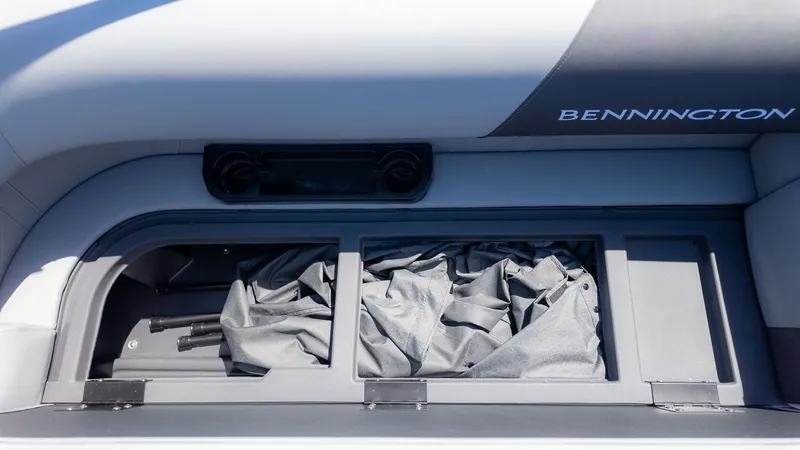 Slide: The Image of Interior view of a Bennington 20 S Cruise with storage compartment and cover. - 12