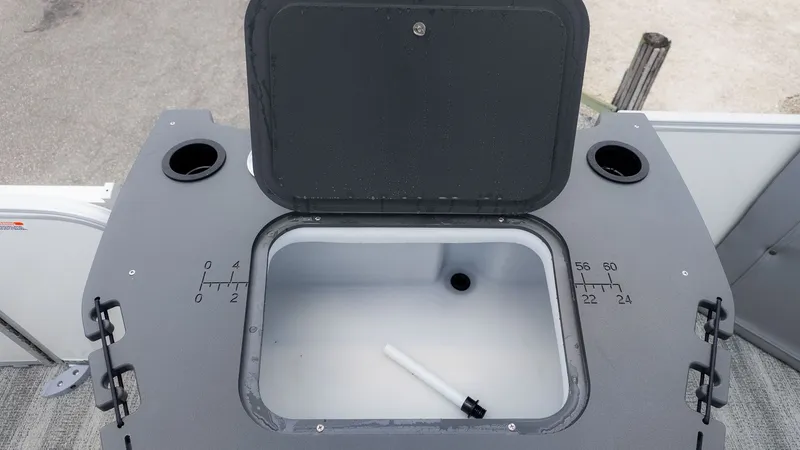 Slide: The Image of A gray boat tank with measurement scale and two cup holders. - 5