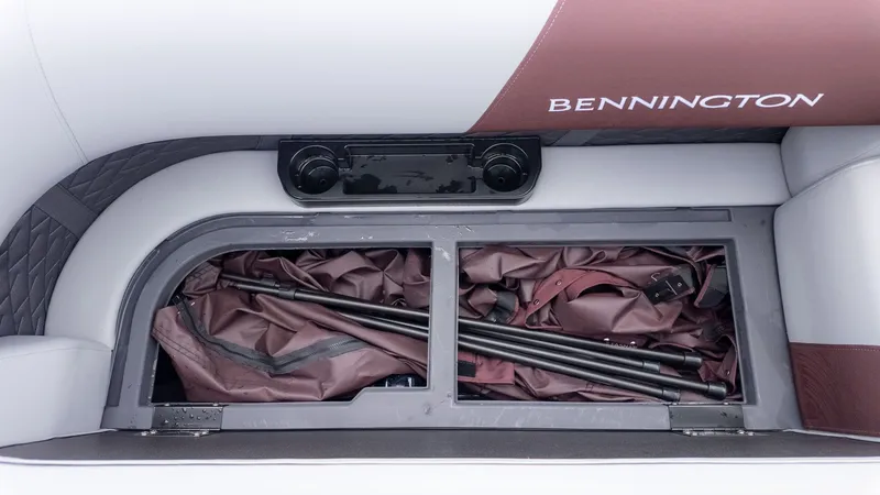 Slide: The Image of Storage compartment on a Bennington boat with poles and covers. - 14