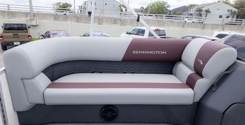 Slide: The Image of Bennington 21 S Fish and Cruise 2026: Elegant seating with gray and maroon upholstery. - 13