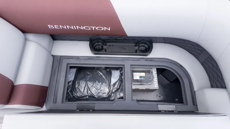 Slide: The Image of Interior view of a Bennington boat with storage compartment and Garmin device. - 12