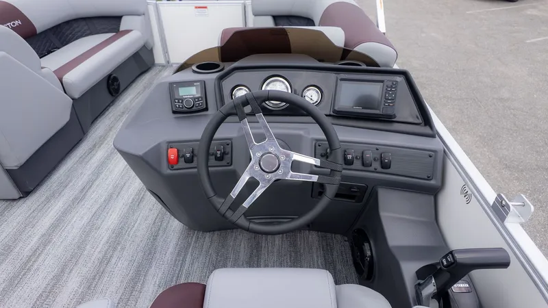 Slide: The Image of The image shows the helm of a 2026 Bennington 21 S Fish and Cruise boat. - 16