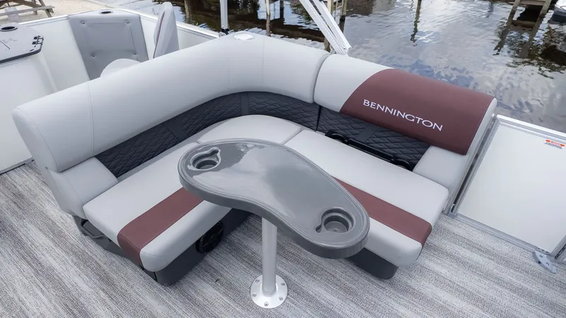 Slide: The Image of Bennington 21 S Fish and Cruise 2026: Elegant seating with gray and brown upholstery on a boat. - 5