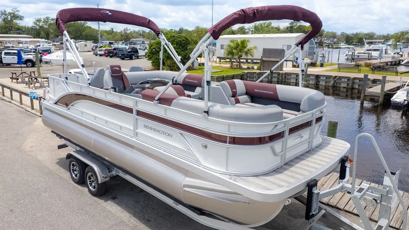 Slide: The Image of Bennington 21 S Fish and Cruise pontoon boat on a trailer, ready for the water. - 19
