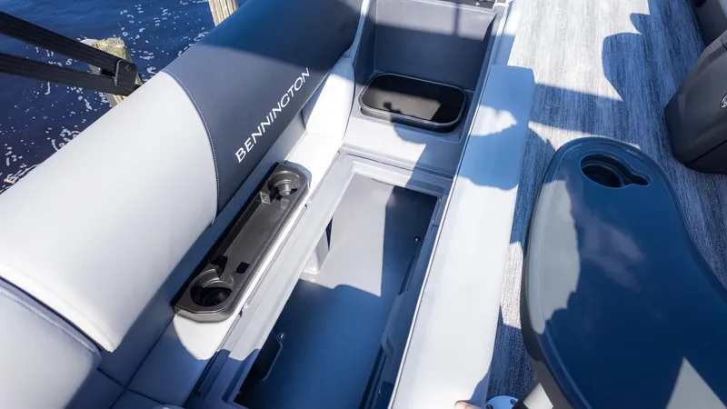 Slide: The Image of Bennington 21 S CRUISE 2026: Seating area with storage and cup holders. - 8