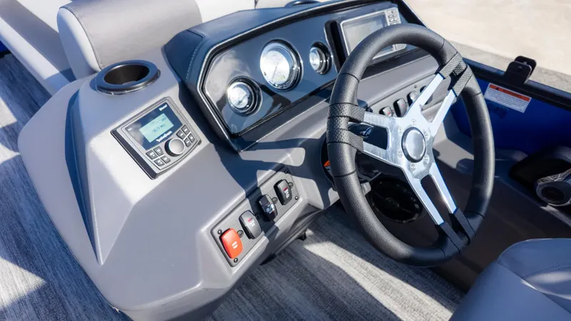 Slide: The Image of The image shows the helm of a 2026 Bennington 21 S CRUISE boat. - 18
