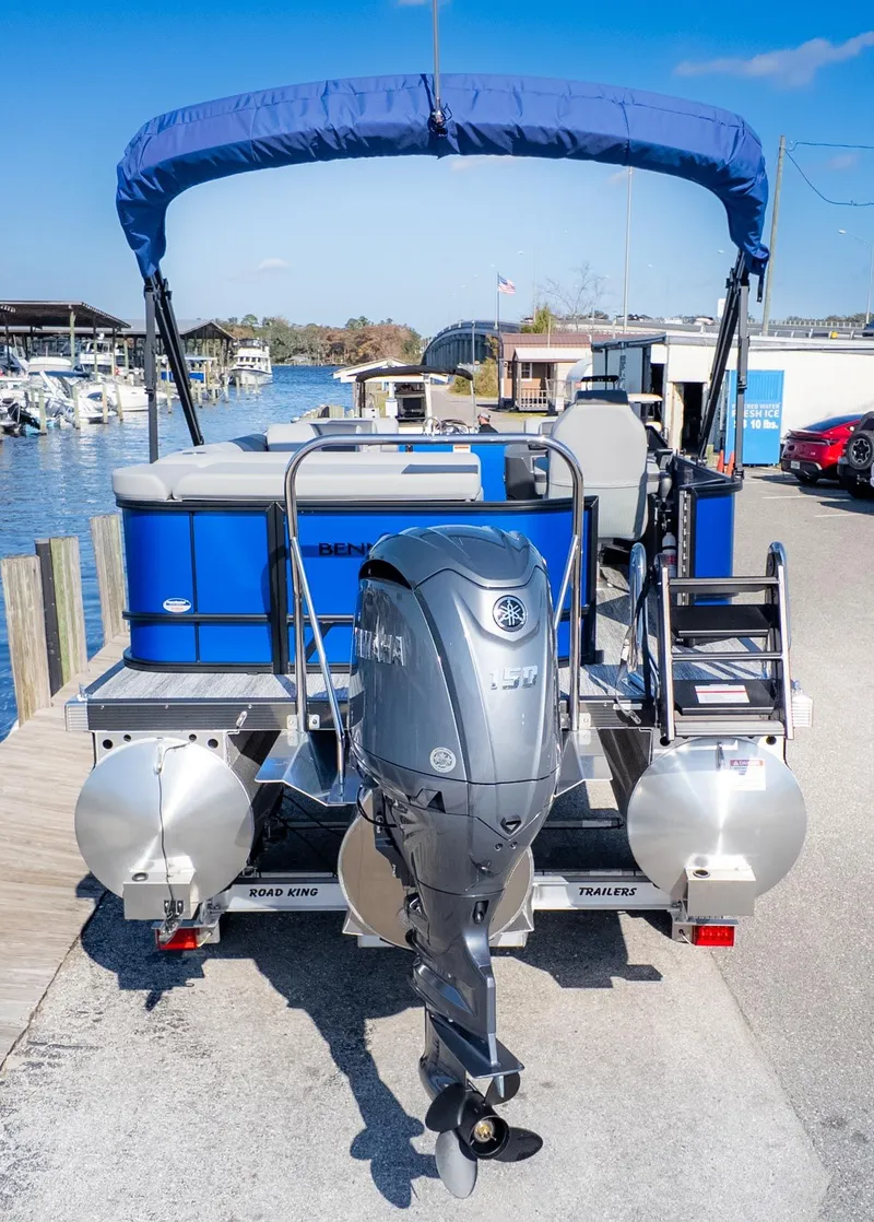 Slide: The Image of Bennington 21 S CRUISE pontoon boat with blue canopy and Yamaha outboard motor at the dock. - 3
