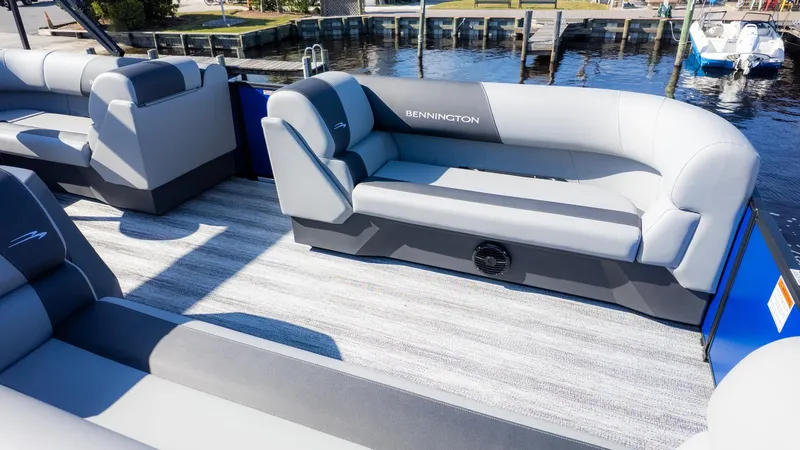Slide: The Image of The image shows the interior of a Bennington 21 S CRUISE pontoon boat with gray seating. - 8