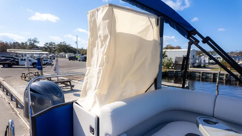 Slide: The Image of 2026 Bennington 21 S CRUISE with sunshade and comfortable seating at the marina. - 5