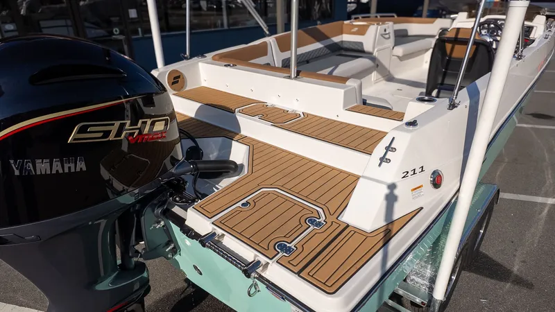 Slide: The Image of The image shows a Starcraft SVX 211 OB boat with a Yamaha outboard motor. - 4