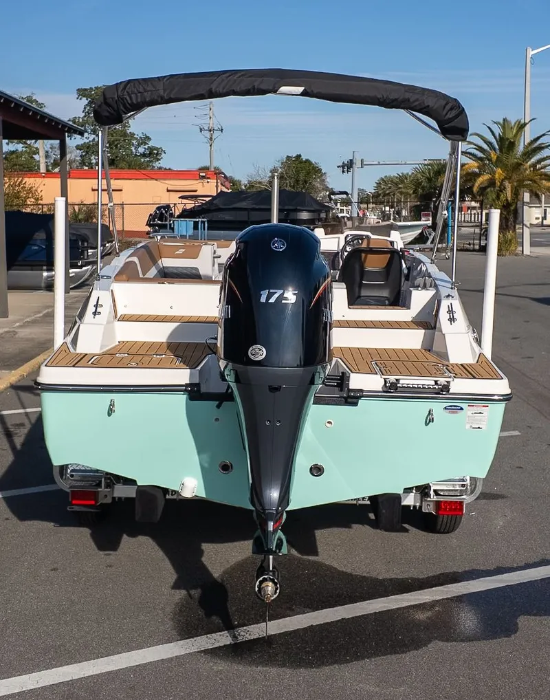 Slide: The Image of The image shows a 2026 Starcraft SVX 211 OB boat on a trailer. - 3