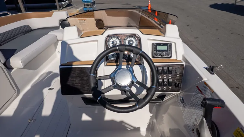 Slide: The Image of The image shows the helm of a Starcraft SVX 211 OB boat. - 20