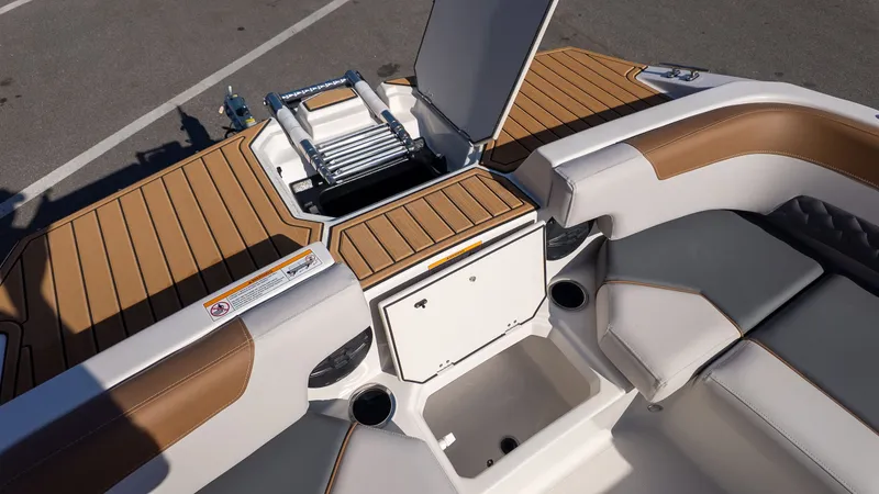 Slide: The Image of The image shows the cockpit of a Starcraft SVX 211 OB with brown and white upholstery. - 15