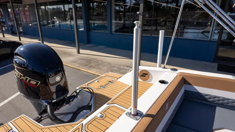 Slide: The Image of The image shows the stern of a Starcraft SVX 211 OB with an outboard motor. - 7