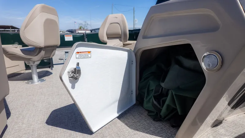 Slide: The Image of Interior of a Bennington 21 S Fishing boat with storage compartment and seats. - 17