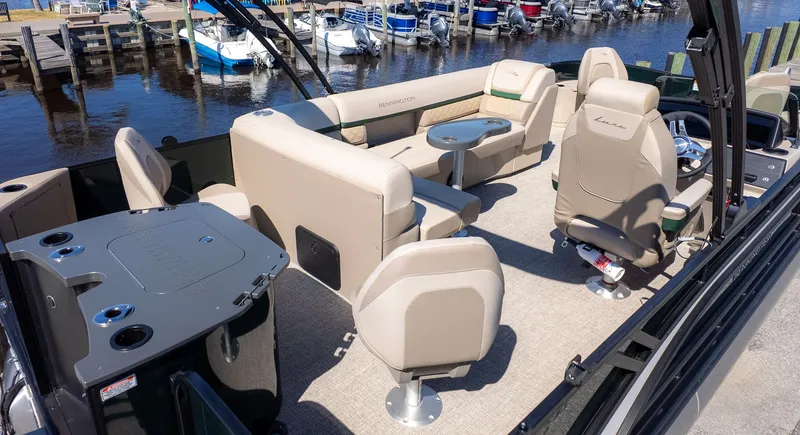 Slide: The Image of The image shows a 2026 Bennington 21 S Fishing boat with beige seating and a table. - 4