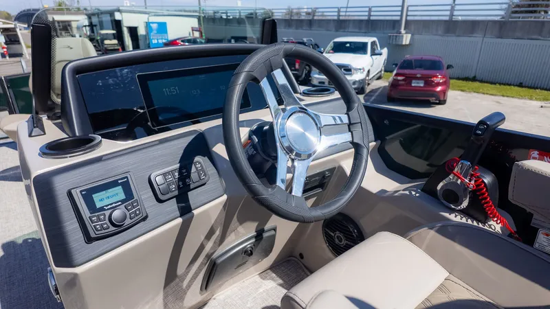 Slide: The Image of The image shows the cockpit of a 2026 Bennington 21 S Fishing boat with modern controls. - 19