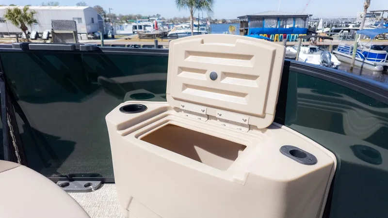 Slide: The Image of An open storage compartment on a boat overlooking a marina. - 13