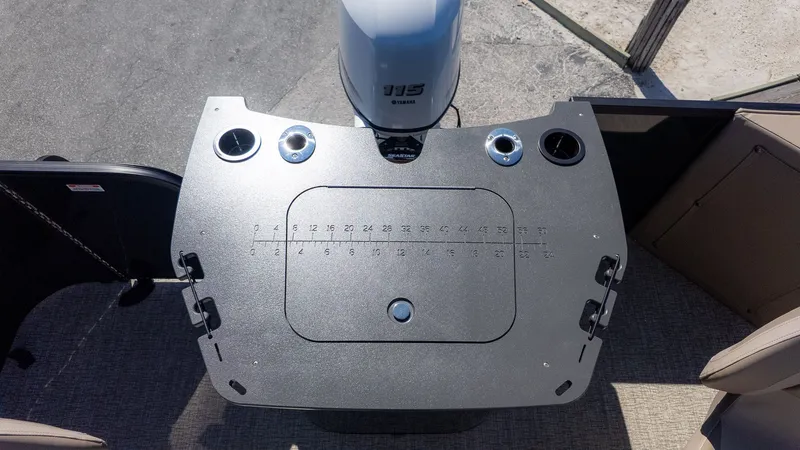 Slide: The Image of The image shows the stern of a Bennington 21 S Fishing boat with an outboard motor. - 4