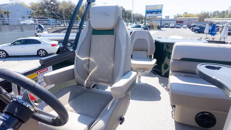 Slide: The Image of Interior of a Bennington 21 S Fishing boat with comfortable seating and steering wheel. - 18