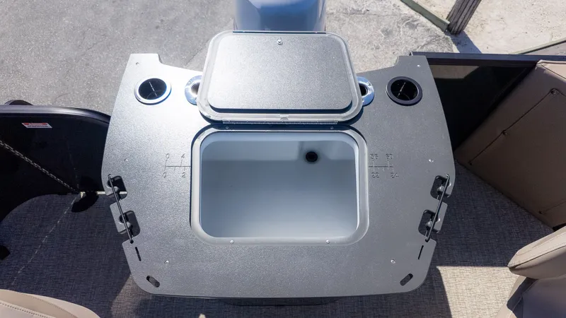 Slide: The Image of The image shows a boat with an open storage compartment lid and cup holders. - 5