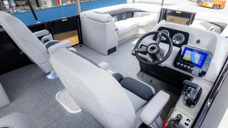 Slide: The Image of Interior of a 2026 Barletta ARIA 22QC with gray seating and a modern helm station. - 18