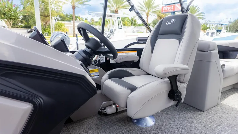 Slide: The Image of The helm of the 2026 Barletta ARIA 22QC features a comfortable captain's chair and modern steering wheel. - 17