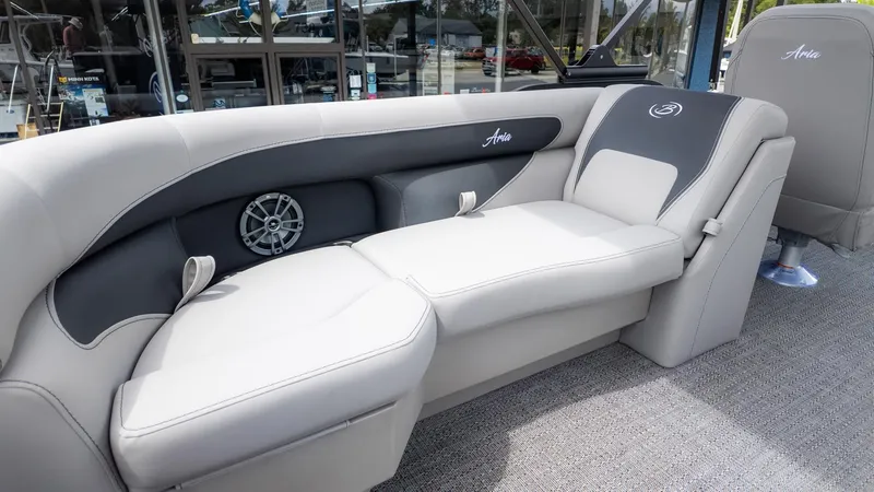 Slide: The Image of The image shows the interior of a Barletta ARIA 22QC boat with gray upholstery. - 9