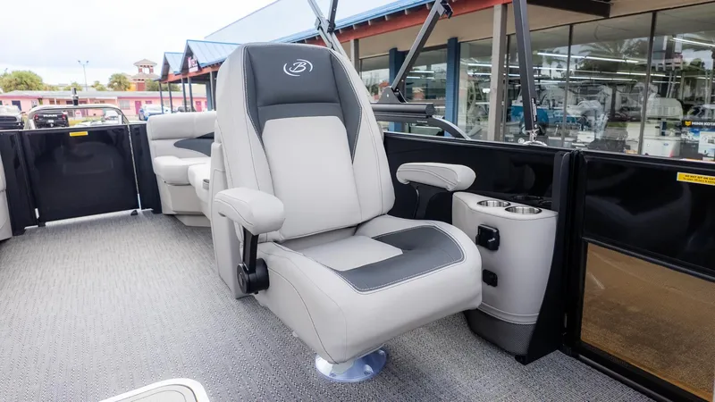 Slide: The Image of The 2026 Barletta ARIA 22QC features a luxurious captain's chair with armrests and cup holders. - 11