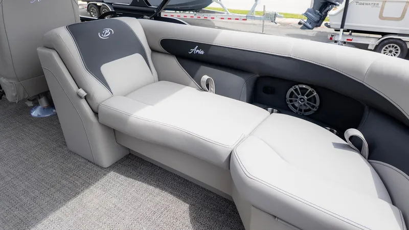 Slide: The Image of The image shows a luxurious lounging area on a Barletta ARIA 22QC boat. - 6