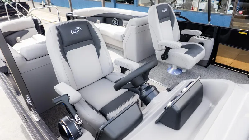 Slide: The Image of Interior of a 2026 Barletta ARIA 22QC with luxurious gray and black seating. - 20