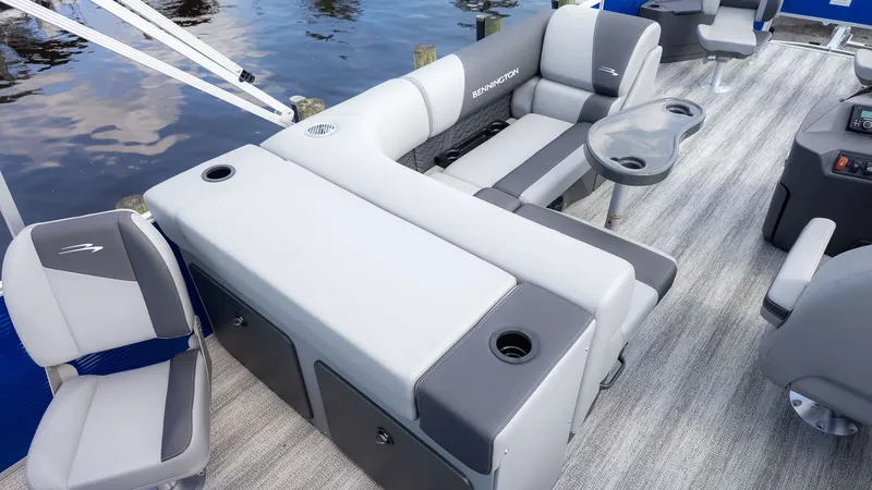 Slide: The Image of The image shows the deck of a Bennington 22 S 4 PT Fishing boat with gray seating. - 7