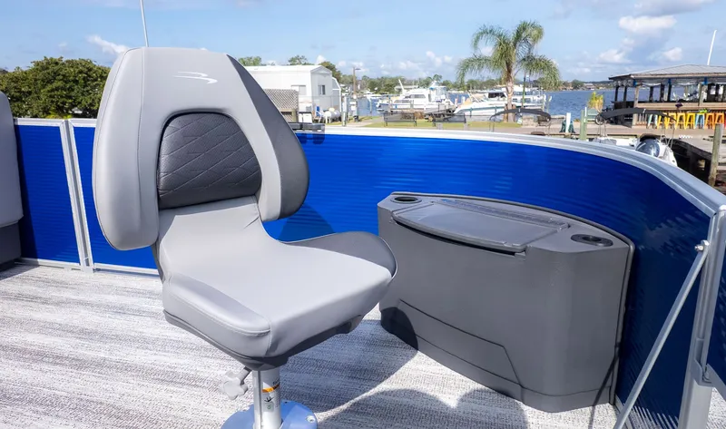 Slide: The Image of A modern boat seat with gray upholstery and black backrest on a Bennington boat. - 12