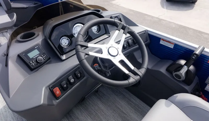 Slide: The Image of The image shows the helm of a Bennington 22 S 4 PT Fishing boat with modern instruments. - 17