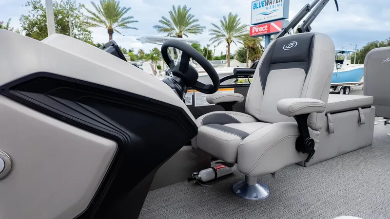 Slide: The Image of The image shows the helm of a 2026 Barletta Aria A22CC boat with a comfortable captain's chair. - 22