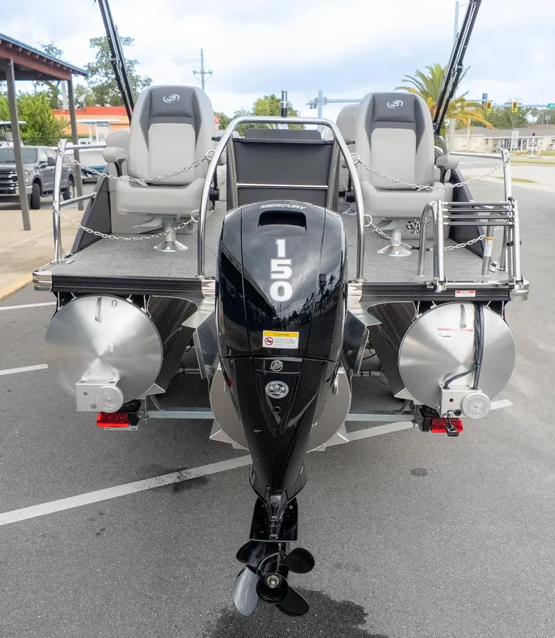Slide: The Image of The image shows a Barletta Aria A22CC pontoon boat with a 150 HP outboard motor. - 4