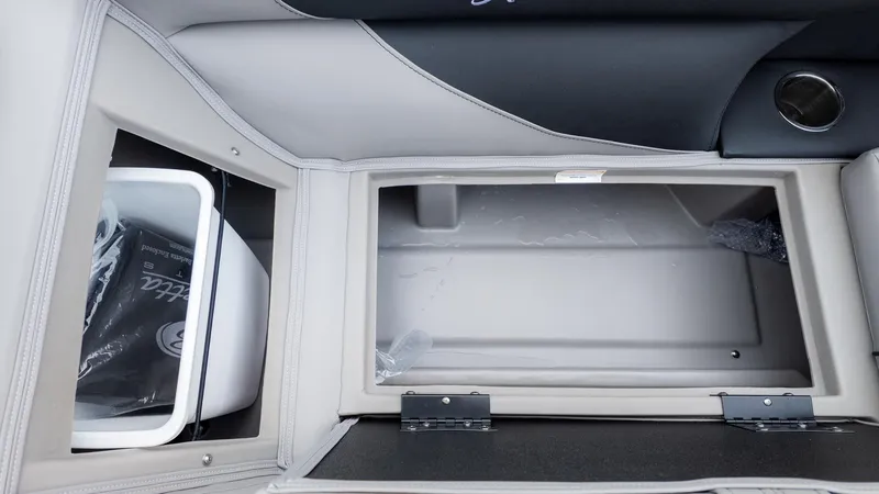 Slide: The Image of Interior view of a Barletta Aria A22CC with storage compartment and cooler. - 18