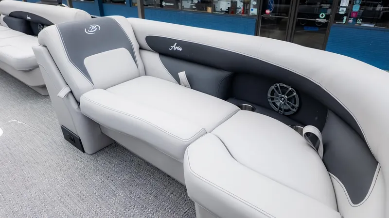 Slide: The Image of The image shows the interior of a Barletta Aria A22CC boat with gray upholstery. - 15
