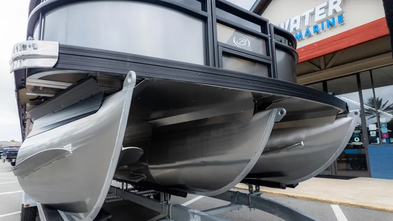 Slide: The Image of Close-up of the Barletta Aria A22CC pontoon boat on a trailer. - 3